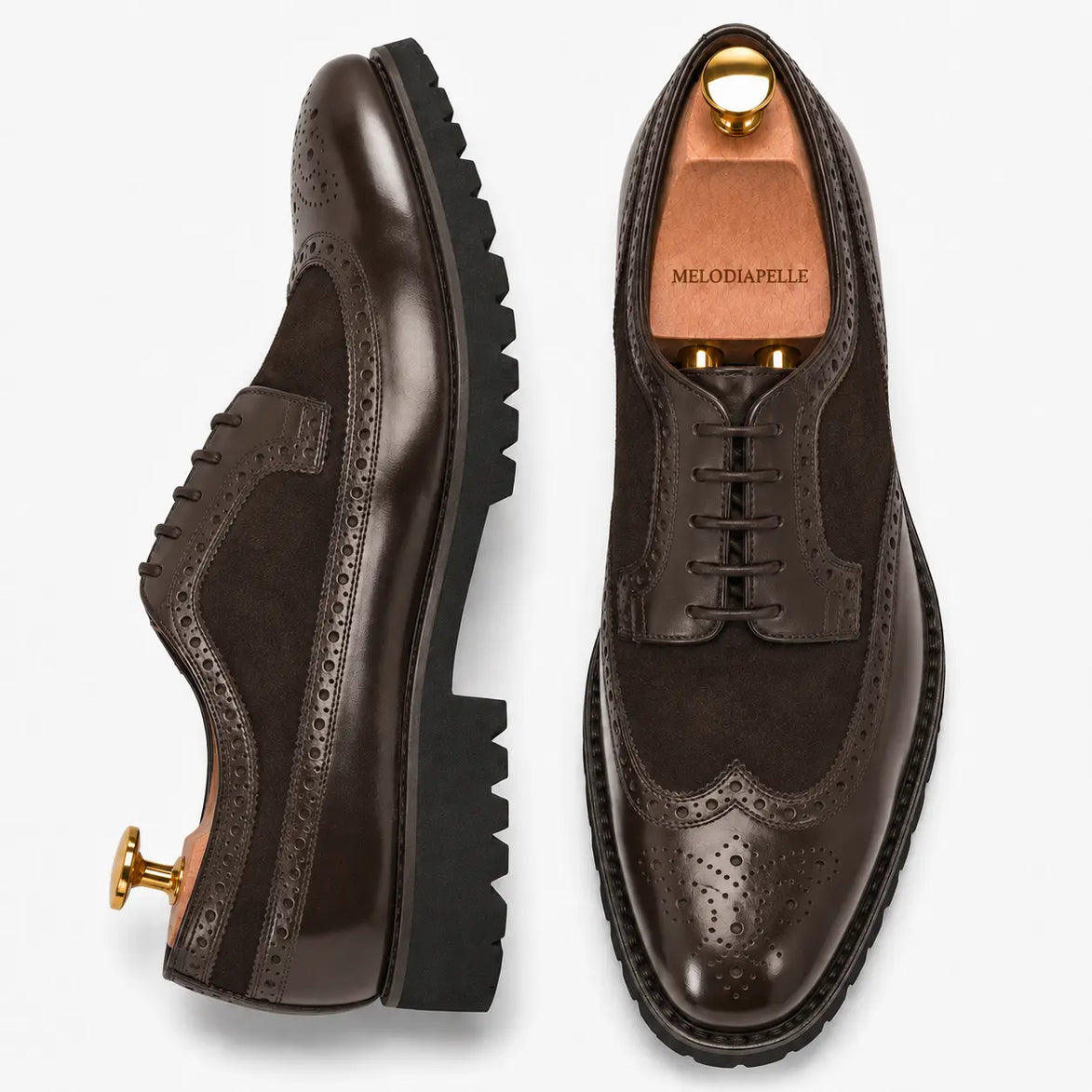 Brown leather two-tone wingtip Derby, three-quarter angle showing heel and brogue detailing