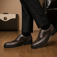 Melodiapelle Mosaic Two-Tone Wingtip Derby in brown leather worn with formal trousers, on-feet shot