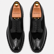 Melodiapelle Mosaic Two-Tone Wingtip Derby in nero black leather, pair top-down view, handcrafted in Agra