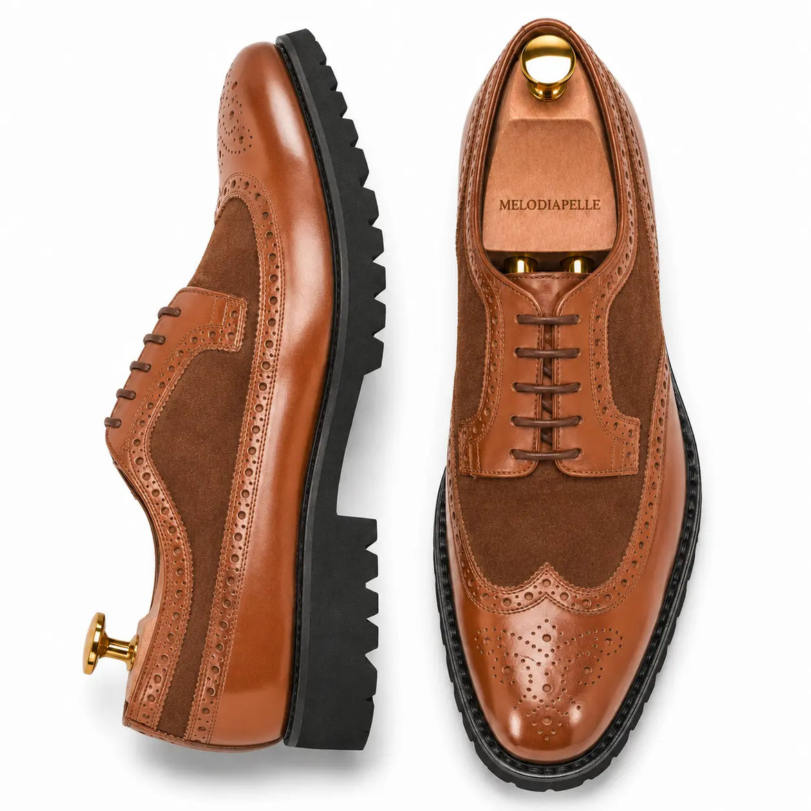 Tan leather two-tone wingtip Derby, three-quarter angle showing heel and brogue detailing