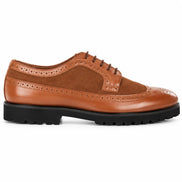 Side profile of the Mosaic Two-Tone Wingtip Derby in tan leather on white background