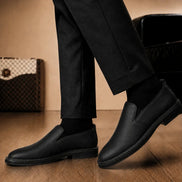Melodiapelle Moscow Opera Slip-On in black leather worn with trousers, on-feet shot