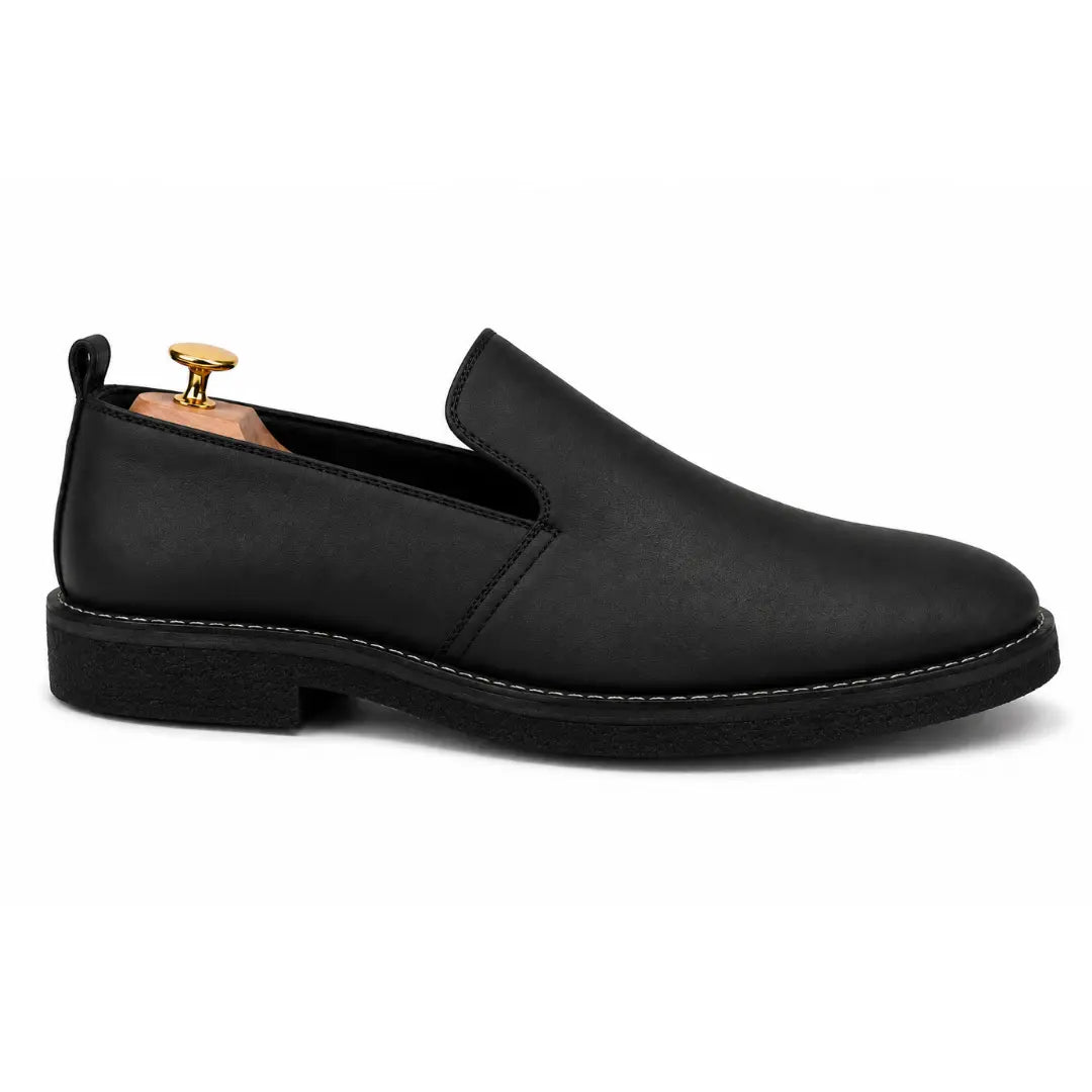 Side profile of the Moscow Opera Slip-On in black leather on white background