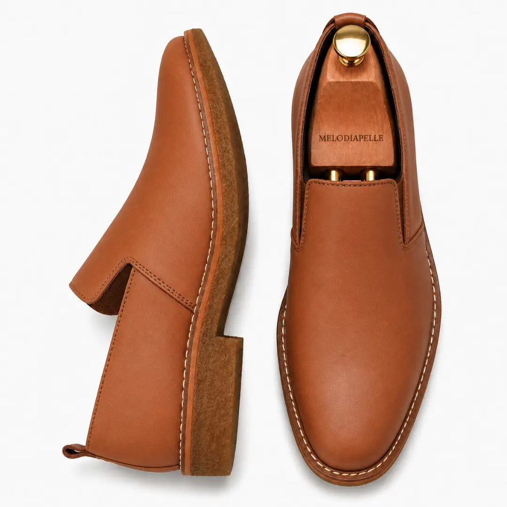 Tan leather opera slip-on, three-quarter angle showing heel and gusset detailing