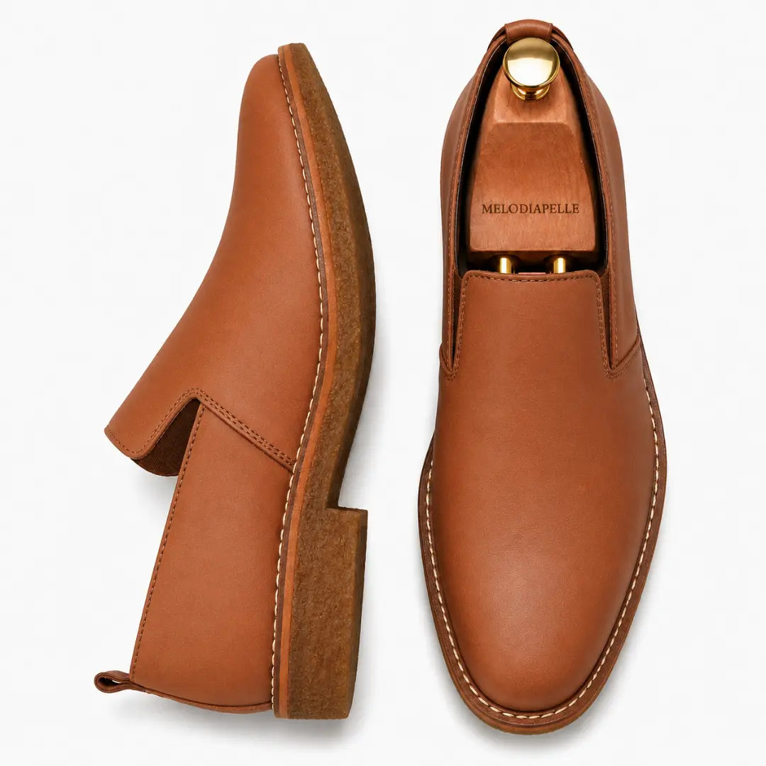 Tan leather opera slip-on, three-quarter angle showing heel and gusset detailing