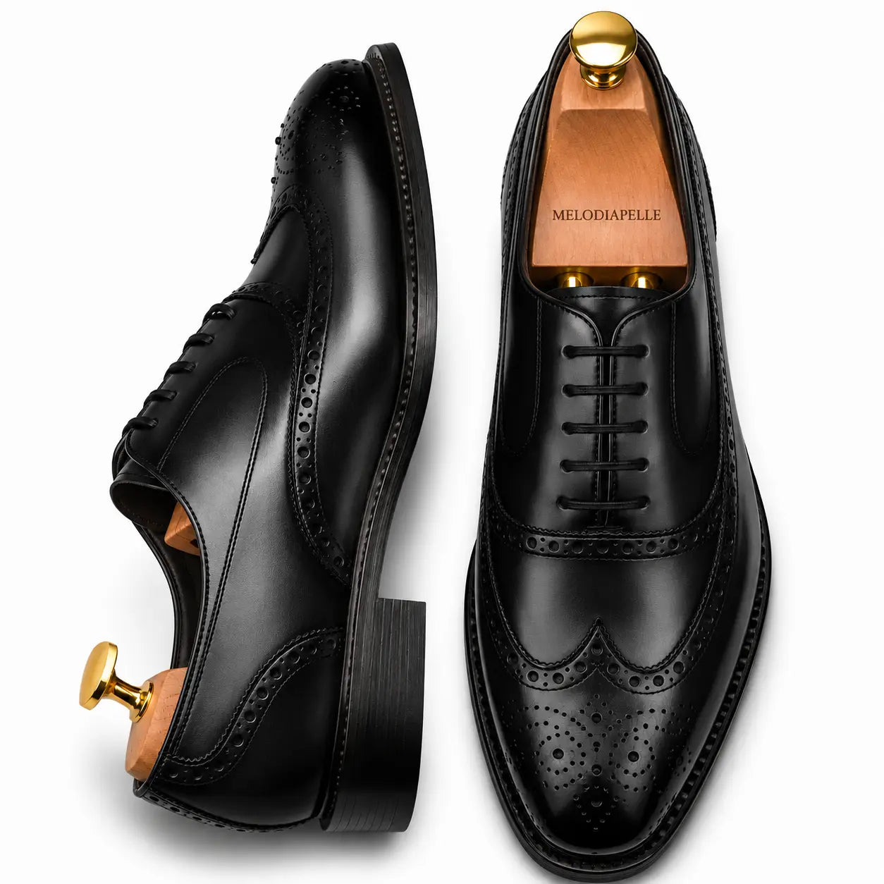 Black leather wingtip brogue Oxford, three-quarter angle showing heel and brogue detailing