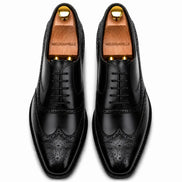 Melodiapelle Mossverde Wingtip Brogue Oxford in black leather, pair top-down view, handcrafted in Agra