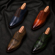  Melodiapelle Mossverde Wingtip Brogue Oxford collection in sage green, tan, brown and black leather, handcrafted wingtip brogue Oxford shoes displayed together