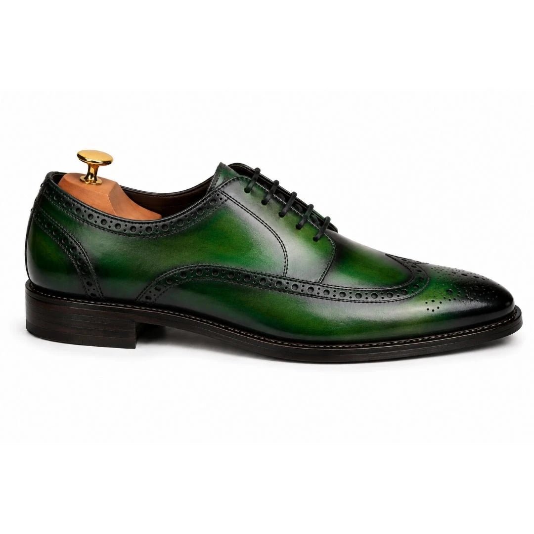 Side profile of the Mossverde Wingtip Brogue Oxford in sage green leather on white background