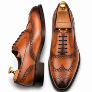Tan leather wingtip brogue Oxford, three-quarter angle showing heel and brogue detailing