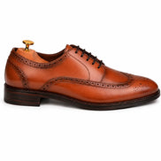 Side profile of the Mossverde Wingtip Brogue Oxford in tan leather on white background