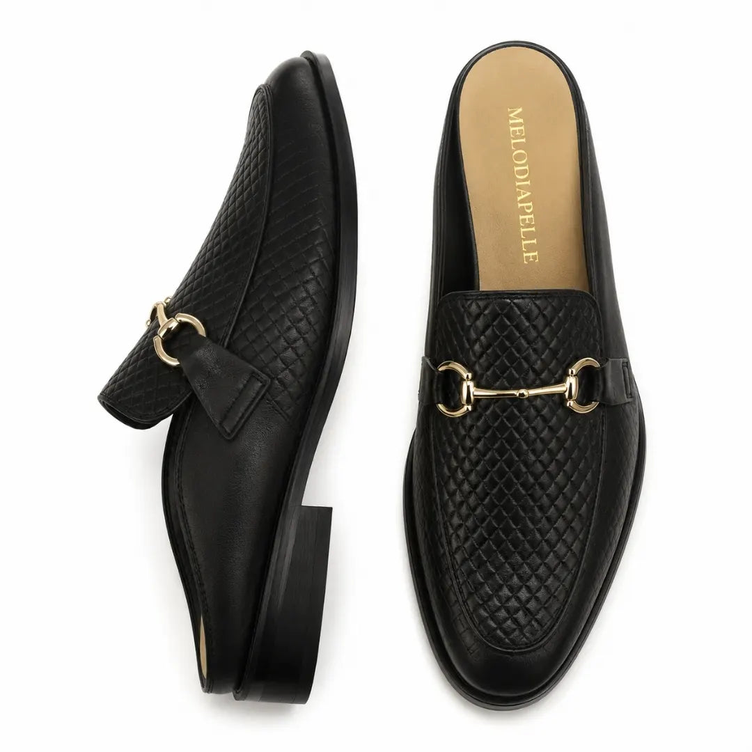 Black woven leather horsebit mule, three-quarter angle showing buckle and heel