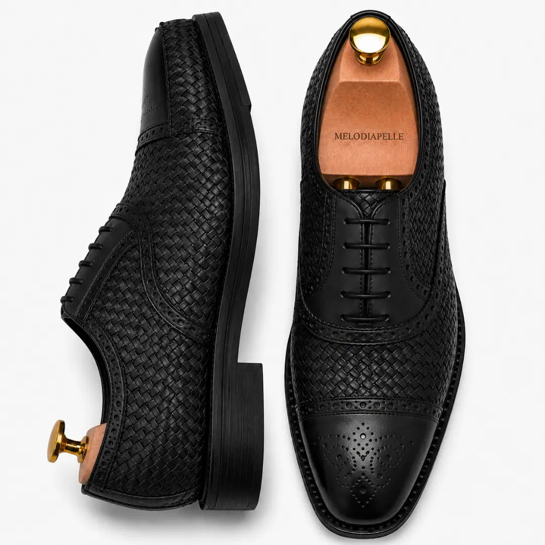 Black leather woven brogue Oxford, three-quarter angle showing heel and brogue detailing