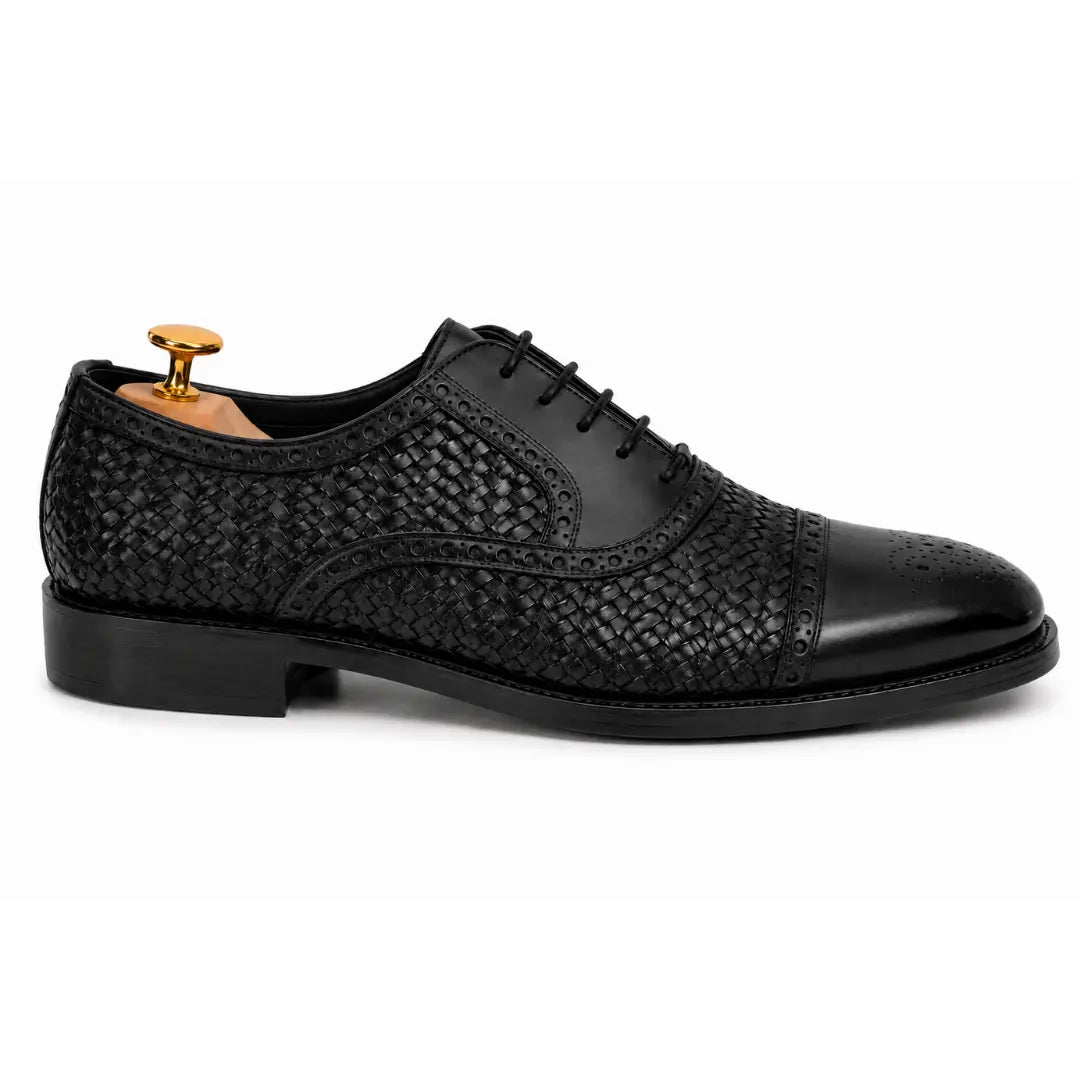 Side profile of the Munich Woven Brogue Oxford in black leather on white background