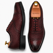 Bordeaux leather woven brogue Oxford, three-quarter angle showing heel and brogue detailing