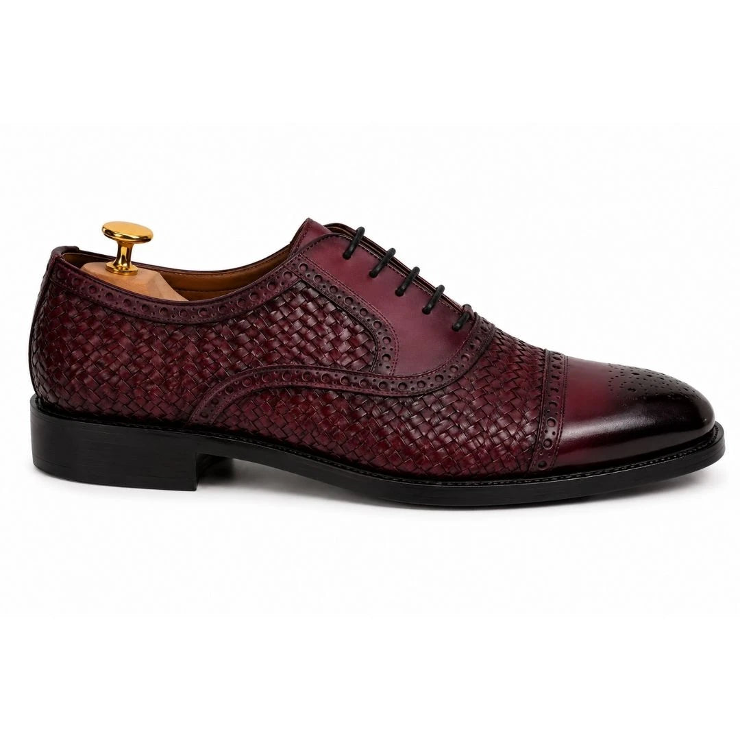 Side profile of the Munich Woven Brogue Oxford in bordeaux leather on white background