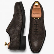Brown leather woven brogue Oxford, three-quarter angle showing heel and brogue detailing