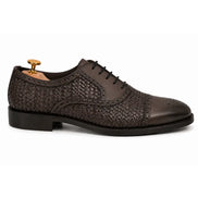 Side profile of the Munich Woven Brogue Oxford in brown leather on white background