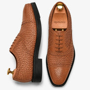 Tan leather woven brogue Oxford, three-quarter angle showing heel and brogue detailing