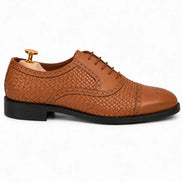 Side profile of the Munich Woven Brogue Oxford in tan leather on white background