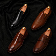 Melodiapelle Mustang Croc-Penny Loafer collection in black, tan and brown leather, handcrafted croc-embossed penny loafer shoes displayed together