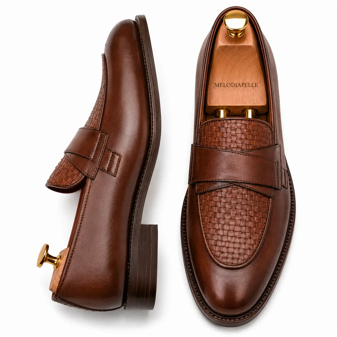 Dark chocolate leather croc-embossed penny loafer, three-quarter angle showing heel and saddle detailing