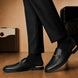 Melodiapelle Mustang Mule in black leather worn with trousers, on-feet shot