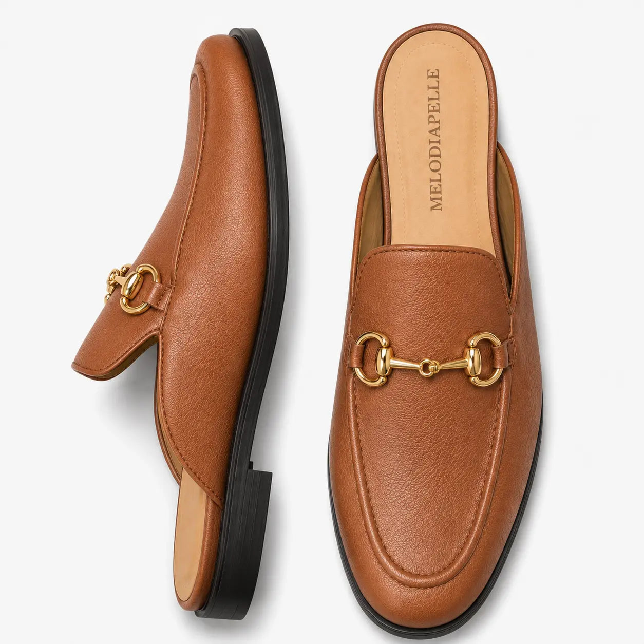 Tan leather horsebit mule, three-quarter angle showing sole detailing