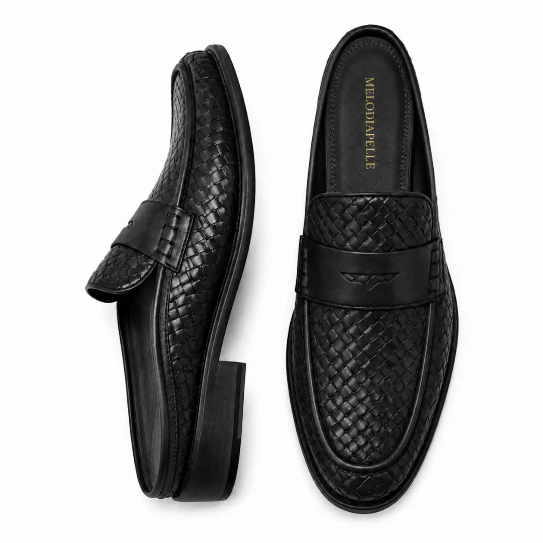 Black woven leather penny mule, three-quarter angle showing heel and woven texture