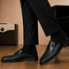 Melodiapelle Rossi Mule in black woven leather worn with trousers, on-feet shot