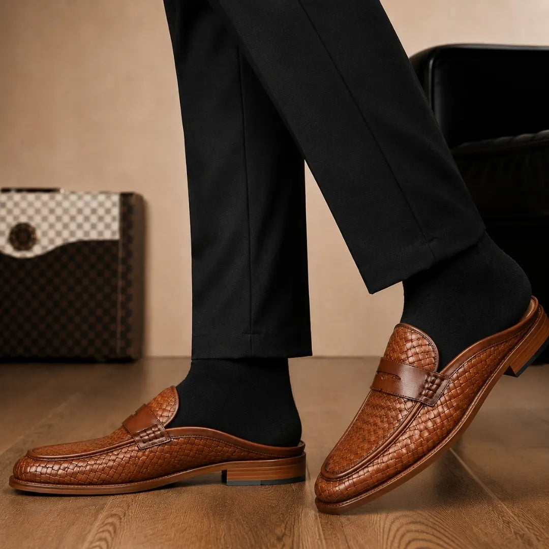Melodiapelle Rossi Mule in cognac tan woven leather worn with trousers, on-feet shot