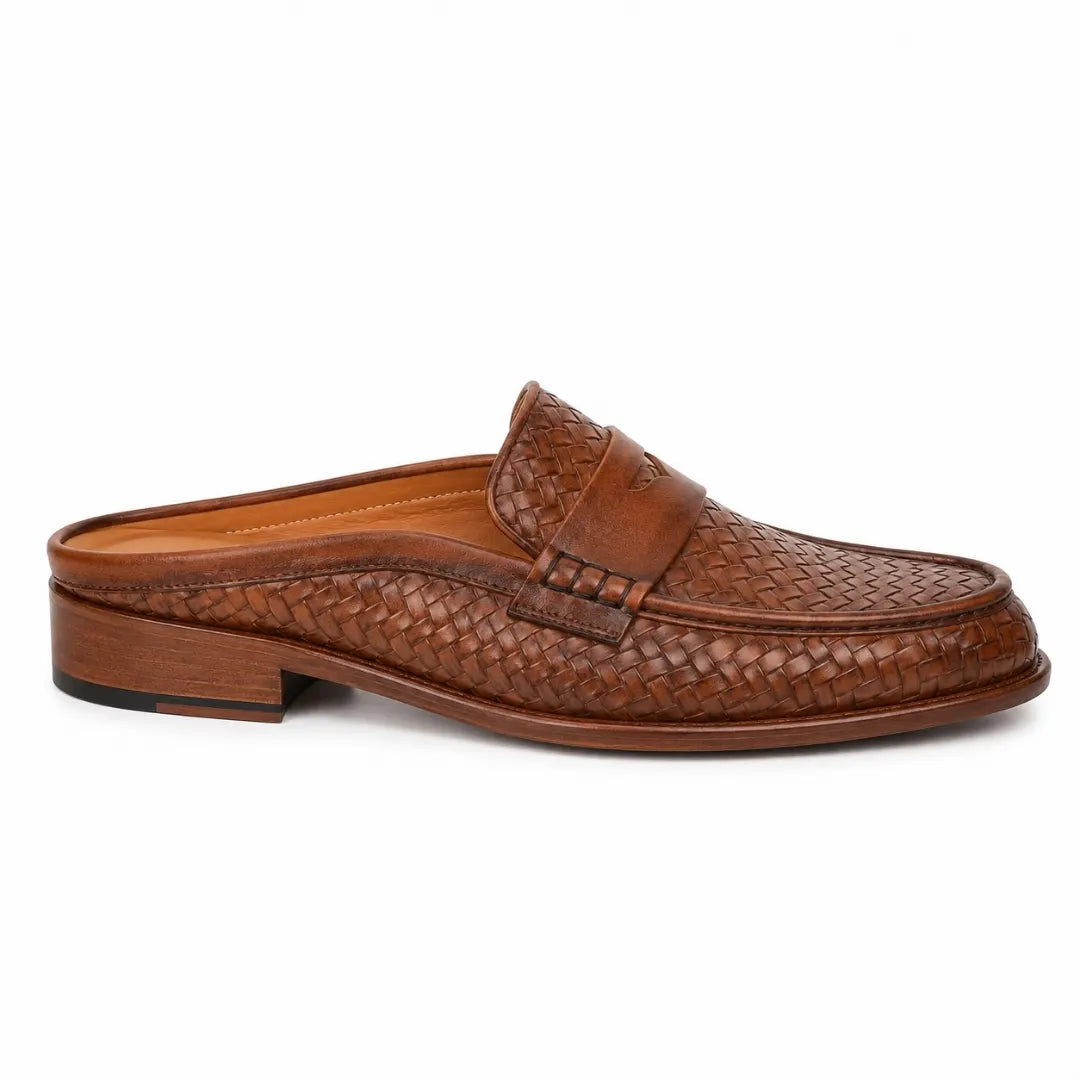 Side profile of the Rossi Mule in cognac tan woven leather on white background