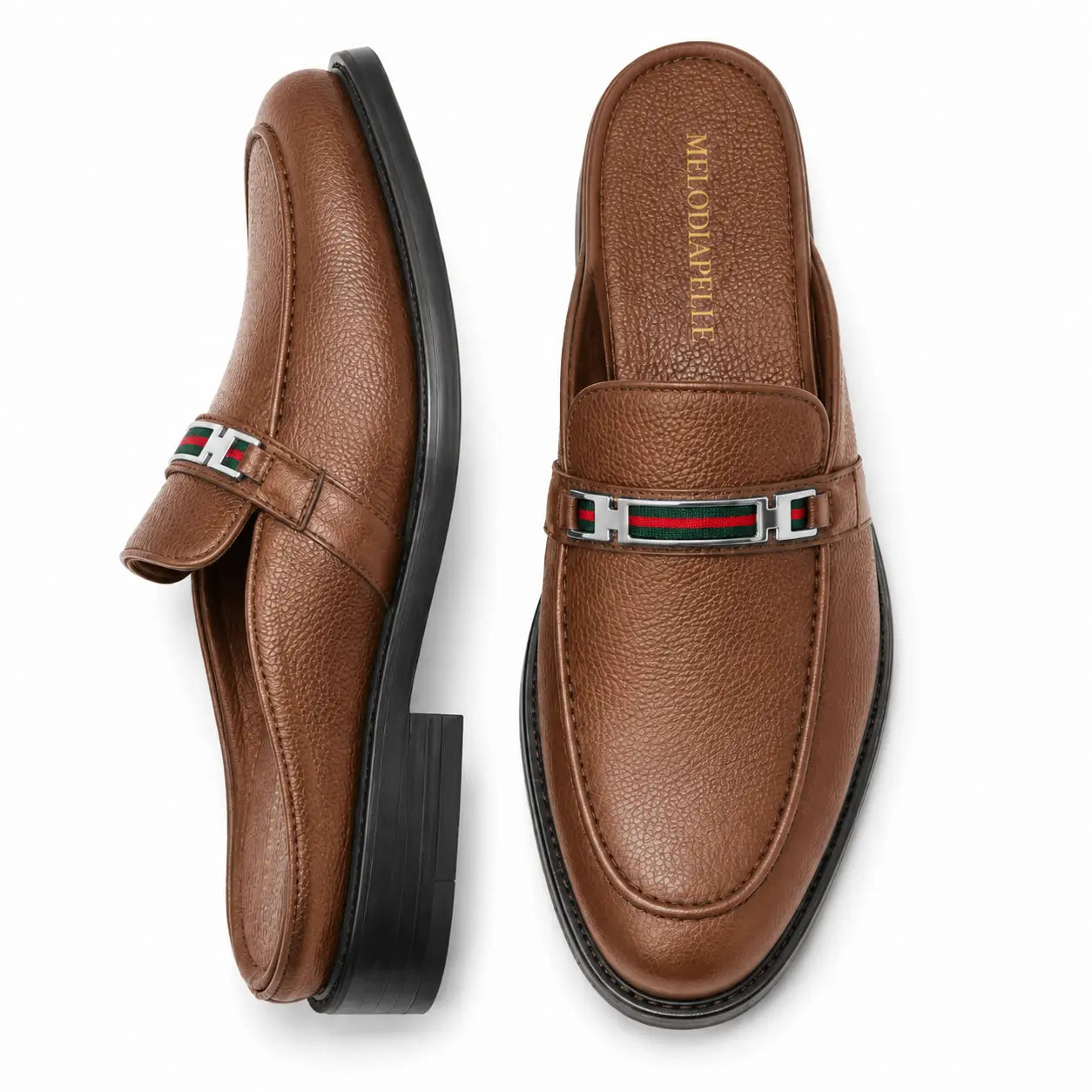 Tan leather bit-buckle mule loafer, three-quarter angle showing heel and buckle detailing